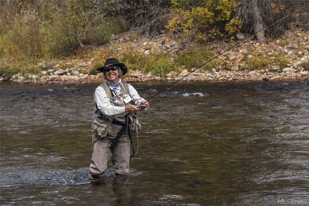 Woman fly-fishing in the Fryingpan River
